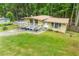 Inviting front yard with a well-manicured lawn, mature trees, and a charming facade at 1188 Cedar Park Cir, Stone Mountain, GA 30083