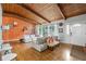 Bright living room featuring hardwood floors, exposed beam ceilings, and a cozy seating arrangement at 1188 Cedar Park Cir, Stone Mountain, GA 30083
