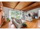 Spacious living room offers an open floor plan and large windows with natural light and hardwood floors at 1188 Cedar Park Cir, Stone Mountain, GA 30083
