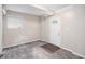 Finished basement area featuring carpet flooring and access to an exterior door at 261 Hemphill School Nw Rd, Atlanta, GA 30331