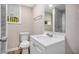 Bathroom features a single sink vanity, a toilet, and a shower with glass doors at 261 Hemphill School Nw Rd, Atlanta, GA 30331