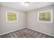 Bedroom filled with natural light from two windows with carpeted floors at 261 Hemphill School Nw Rd, Atlanta, GA 30331