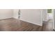 Spacious living room area with hardwood flooring, showcasing a clean and neutral color palette at 261 Hemphill School Nw Rd, Atlanta, GA 30331