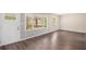Bright living room featuring hardwood floors, a large window and a view of the front porch at 261 Hemphill School Nw Rd, Atlanta, GA 30331