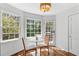 Sunlit breakfast nook with hardwood floors, bright windows and a small table at 4257 Edgewater Nw Dr, Kennesaw, GA 30144