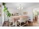 Charming dining room with neutral decor, a decorative chandelier, and abundant natural light at 4257 Edgewater Nw Dr, Kennesaw, GA 30144