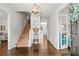 Bright foyer with hardwood floors, staircase, elegant chandelier and a beautiful entry door at 4257 Edgewater Nw Dr, Kennesaw, GA 30144