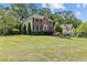 Traditional brick home with lush front yard and manicured landscaping at 4257 Edgewater Nw Dr, Kennesaw, GA 30144