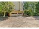 Attached two-car garage with a wide driveway, complemented by lush greenery at 4257 Edgewater Nw Dr, Kennesaw, GA 30144