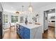 Spacious kitchen island featuring seating, white countertops, and blue cabinetry at 4257 Edgewater Nw Dr, Kennesaw, GA 30144
