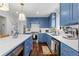Bright kitchen with blue cabinets, white countertops, and stainless steel appliances at 4257 Edgewater Nw Dr, Kennesaw, GA 30144
