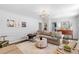 Comfortable living room featuring a fireplace, a sectional sofa, and neutral tones at 4257 Edgewater Nw Dr, Kennesaw, GA 30144