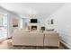 Bright living room with a fireplace, large windows, and comfortable seating at 4257 Edgewater Nw Dr, Kennesaw, GA 30144