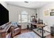 Well-lit office with a large window, a desk, and comfortable seating, perfect for remote work at 4257 Edgewater Nw Dr, Kennesaw, GA 30144
