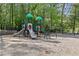 Community playground with slides and play structures surrounded by mature trees at 4257 Edgewater Nw Dr, Kennesaw, GA 30144