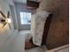 Comfortable bedroom featuring a ceiling fan, natural light, and coordinating wood furnishings at 475 Sw Willard Ave, Atlanta, GA 30310