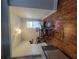 Dining area with hardwood floors, modern lighting, and comfortable seating for entertaining at 475 Sw Willard Ave, Atlanta, GA 30310