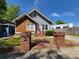 Charming home featuring unique architectural details and a welcoming brick entrance at 475 Sw Willard Ave, Atlanta, GA 30310