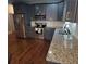 Kitchen with granite countertops, stainless steel appliances, and modern gray cabinets at 475 Sw Willard Ave, Atlanta, GA 30310