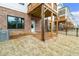 Backyard and outdoor living space with covered patio and fenced yard in a row of townhomes at 708 Dodd Ln # 156, Buford, GA 30518