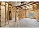 Unfinished basement with wooden framing and insulation, ready for customization at 708 Dodd Ln # 156, Buford, GA 30518