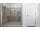 Modern bathroom with glass shower, tiled walls, and built-in bench at 708 Dodd Ln # 156, Buford, GA 30518