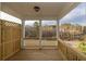 Outdoor patio features wood flooring, view of trees, and partial privacy fencing at 708 Dodd Ln # 156, Buford, GA 30518