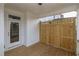 Covered porch with privacy screen, exterior door, and light-colored wood flooring at 708 Dodd Ln # 156, Buford, GA 30518