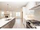 Open concept kitchen features a large island, stainless appliances, and a clear view of living space at 708 Dodd Ln # 156, Buford, GA 30518