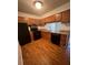 Well-equipped kitchen with modern appliances, granite countertops, ample cabinet space, and hardwood floors at 114 Seasons Pkwy, Norcross, GA 30093