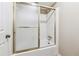 Bathroom features a white tub with gold hardware and sliding glass shower door at 3200 Turtle Lake Se Ct, Marietta, GA 30067