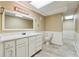 Finished bathroom with marble top vanity, white cabinets, large mirror, and recessed lighting at 3200 Turtle Lake Se Ct, Marietta, GA 30067
