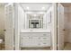 Functional bathroom with a vanity, a large mirror, and access to closet space and the toilet area at 3200 Turtle Lake Se Ct, Marietta, GA 30067