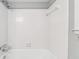 Clean, tiled bathtub and shower area in a bright bathroom, offering a functional and modern space at 3200 Turtle Lake Se Ct, Marietta, GA 30067