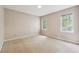 Inviting bedroom with two windows, neutral walls, and comfortable carpeting for a peaceful ambiance at 3200 Turtle Lake Se Ct, Marietta, GA 30067