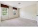 Bright bedroom with two windows, neutral walls, and plush carpeting, offering a calming atmosphere at 3200 Turtle Lake Se Ct, Marietta, GA 30067
