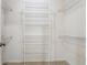 Walk-in closet with carpet flooring and adjustable metal shelving for easy storage at 3200 Turtle Lake Se Ct, Marietta, GA 30067