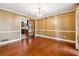 Dining room featuring hardwood floors, chandelier, and decorative trim at 3200 Turtle Lake Se Ct, Marietta, GA 30067