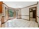 Sunny eat-in area with tile flooring, classic wallpaper, and access to an outdoor area through French doors at 3200 Turtle Lake Se Ct, Marietta, GA 30067