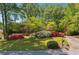 Charming brick home with a well-manicured lawn and lush landscaping at 3200 Turtle Lake Se Ct, Marietta, GA 30067
