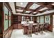 Finished basement bar with dark wood cabinetry, a marble countertop, and seating at 3370 Habersham Nw Rd, Atlanta, GA 30305