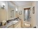 Bathroom features a marble countertop, decorative mirror, and tile flooring at 3370 Habersham Nw Rd, Atlanta, GA 30305