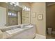 Bright bathroom with double sinks, a large mirror, and a walk-in shower at 3370 Habersham Nw Rd, Atlanta, GA 30305