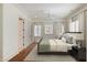 Bedroom with large windows letting in lots of natural light, closet, and light gray walls at 3370 Habersham Nw Rd, Atlanta, GA 30305