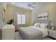 Comfortable bedroom featuring neutral tones, soft natural light and a ceiling fan at 3370 Habersham Nw Rd, Atlanta, GA 30305