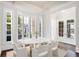 Elegant dining room with large windows and a marble-top table at 3370 Habersham Nw Rd, Atlanta, GA 30305