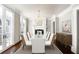 Dining room features a chandelier, fireplace, and elegant white chairs at 3370 Habersham Nw Rd, Atlanta, GA 30305