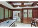 Basement game room with an air hockey table, custom built-ins and wood-paneled walls at 3370 Habersham Nw Rd, Atlanta, GA 30305