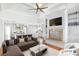 Open-concept living room with a fireplace, built-in shelves, and seamless flow to the modern kitchen at 3370 Habersham Nw Rd, Atlanta, GA 30305