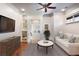 Cozy sitting area with a white couch and a flat screen TV, and hardwood floors at 3370 Habersham Nw Rd, Atlanta, GA 30305